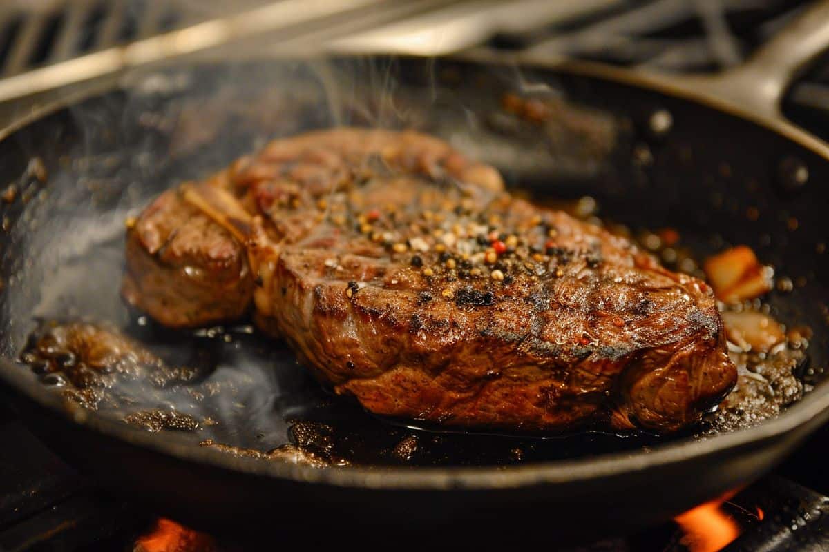 Cooking a steak in a stone pan for even heat distribution.